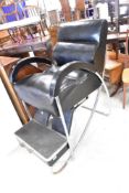 A vintage chrome and black leather Chiropractor/treatment chair, with drawer to step, in need of