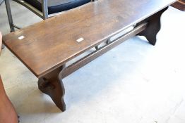 A mid to late 20th Century oak form style bench, approx. 137 x 33cm