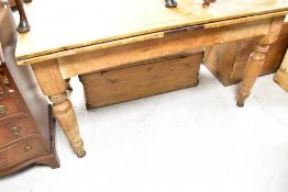 A Victorian and later stripped kitchen table , with drawer leaves and turned legs, dimensions closed