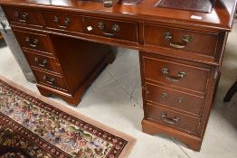 A reproduction Regency pedestal desk, dimensions approx. width 122 depth 61 height 79cm