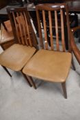 A pair of vintage teak slat back dining chairs , probably G plan