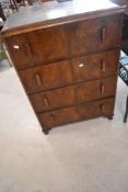 An early to mid 20th Century walnut bedroom chest of four long drawers, labelled for Pauls of