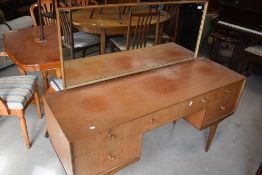 A vintage teak dressing table, labelled McIntosh, width approx. 141cm
