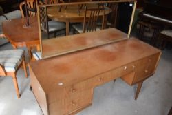 A vintage teak dressing table, labelled McIntosh, width approx. 141cm