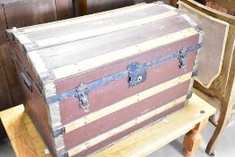 A vintage dome top travel trunk, approx width. 75cm, some signs of historical worm