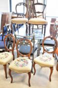A Harlequin set of five (three, one and one) Victorian mahogany railback salon chairs , all with