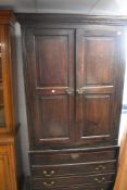 A period oak panelled cupboard having drawer base, dimensions approx. height 221 width 104 depth