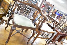 Two Edwardian mahogany salon chairs, being carver and corner