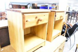 A pair of pine and laminate bedside table, with single drawers