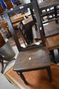 A Georgian oak childs chair having open back, solid seat and turned legs, seat height approx.
