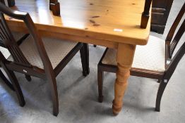 A yellow pine kitchen table having turned legs, approx. 140 x 74cm