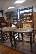 A set of six 19th Century rush seated ladder back chairs