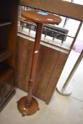 A late 19th or early 20th Century mahogany jardiniere stand having turned column, height approx.