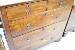 A Vctorian mahogany chest of two short over three long drawers having turned escutcheons and