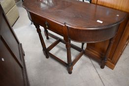 An early 20th Century oak hall table having frieze drawer and turned frame, width approx. 97cm