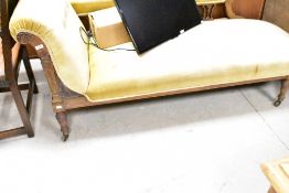 A Victorian mahogany framed chaise longue having ochre dralon upholstery