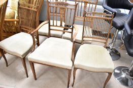 A harlequin set of Edwardian mahogany salon chairs, including one armchair