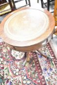 A reproduction Regency occasional table of drum form, diameter approx. 50cm