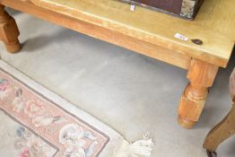 A modern pine coffee table, approx. 100 x 60cm, could do with a revarnish or paint