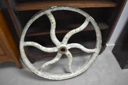A vintage cast iron cart or implement wheel, diameter approx. 68cm