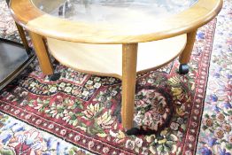 A vintage oak and glass circular coffee table, labelled G Plan, diameter approx. 83cm, on castors