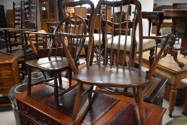 A dark stained Ercol carver chair and similar rocking chair in slightly lighter shade