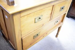 A Victorian chest of two short over three long drawers, on turned legs, campaign style handles to