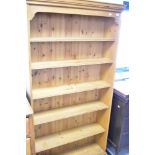 A natural pine full height bookshelf having fixed shelves, dimensions approx. height 185cm, width