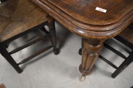A Victorian mahogany wind out dining table , with leaf and winder