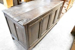 A period oak kist having four panel front, dimensions approx. Width 139 height 76 depth 56cm