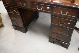 A reproduction Regency pedestal desk, dimensions approx. width 122 depth 61 height 77cm