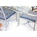 An Italian designer style glass top table with burnished metal frame and set of six (four plus