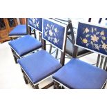 A set of four late 19th or early 20th Century dining chairs having turned frames with upholstered