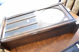 A 1920s oak wall clock