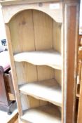 A stripped pine corner shelf, height approx. 75cm