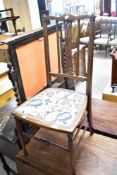 An Edwardian mahogany bedroom chair