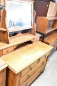 A Victorian oak dressing table , with mirrored backing having dual drawers under shelf, the base