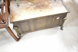 An early 20th Century oak coal purdonium having lift lid, width approx. 59cm, liner present but in