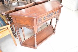 A modern oak old charm or priory style hall table with card frieze drawer, max width approx. 107,