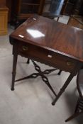 A late Victorian mahogany occasional table having frieze drawer, drop flaps and turned legs, approx.