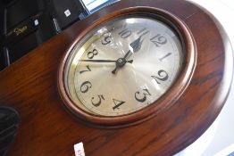 A 1930 or 1940s oak cased long case clock , having triple weight mechanism