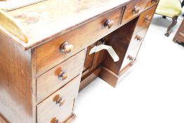A Victorian mahogany kneehole desk or wash stand, having cupboard to recess, dimensions approx.