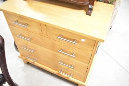 A modern golden oak bedroom chest of two short over three long drawers, width appprox. 81cm, depth
