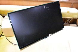 A Samsung 27 inch TV , with Sandstrom wall bracket etc