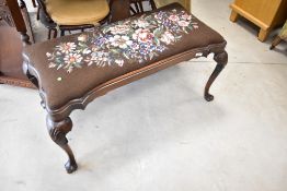 An early 20th Century duet stool/dressing table stool having floral tapestry top , with shaped