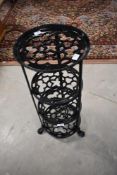 A modern painted metal four tier tapering pan stand, height approx. 70cm
