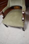 A late 19th or early 20th Century mahogany framed salon tub chair having later green dralon