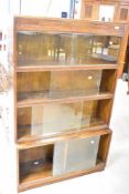 A vintage oak stacking bookcase having four tiers in total , overall height approx. 141cm