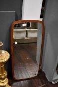 A 20th-century Danish-style teak wood framed wall mirror, of rectangular form with rounded