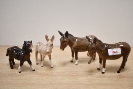 Three 20th-century Beswick Donkey Figurines, to include a Donkey Foal model No.2110 and two Donkey